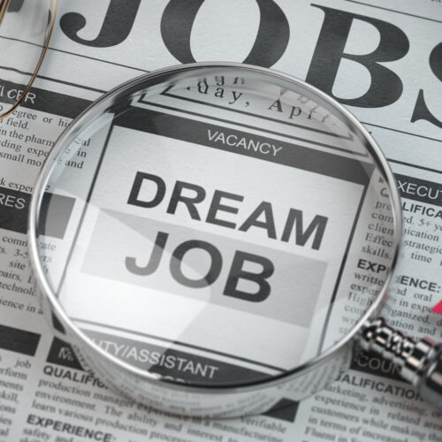 Dream job concept. Job search and employment. Magnified glass wi Dream job concept. Job search and employment. Magnified glass with job classified ads in newspaper, 3d illustration